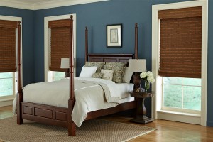 Natural brown woven shades at three bedroom windows adjusted to about waist height